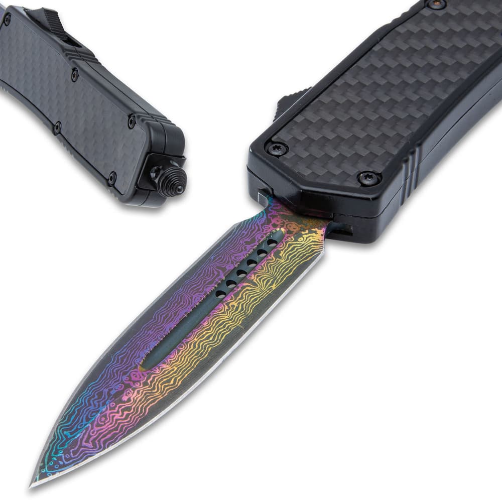 The rainbow anodized, 3 1/2” stainless steel, dagger blade can be quickly deployed with the slide trigger on the side image number 2