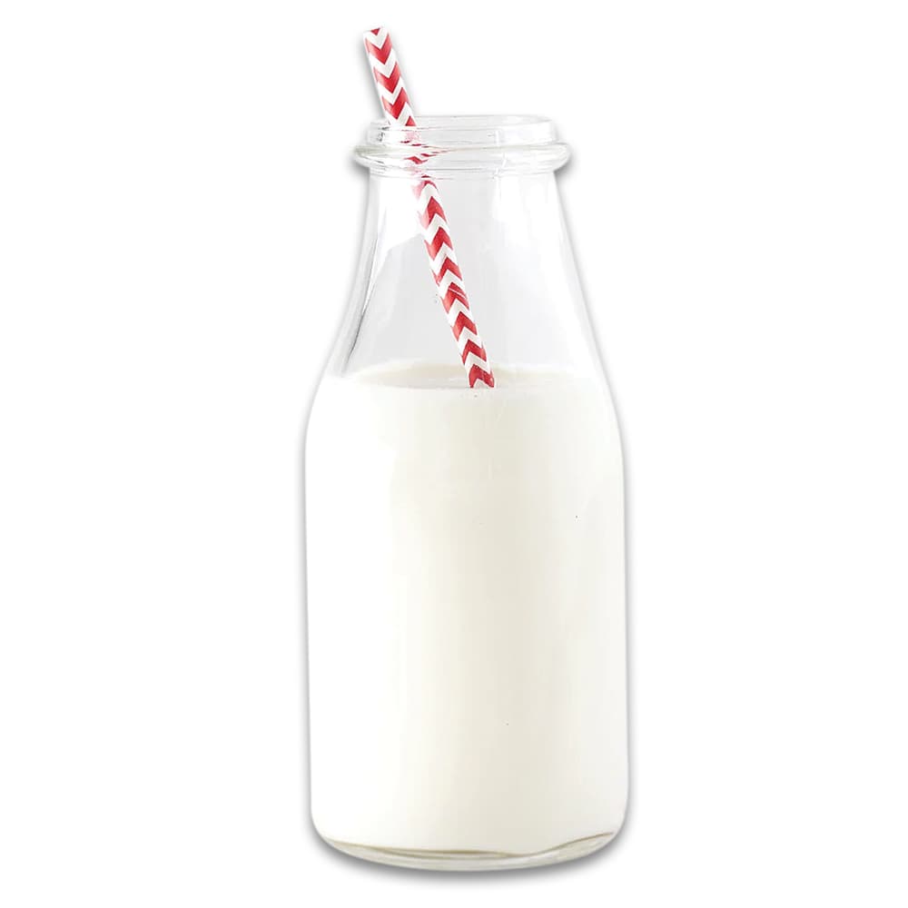 The powdered milk shown reconstituted in a glass container image number 2