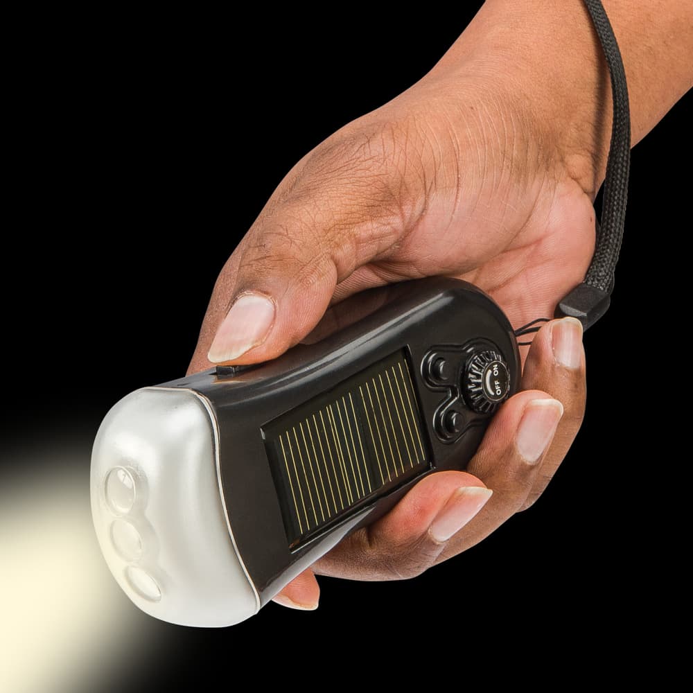 Trailblazer’s Solar Flashlight With Radio has a wrist lanyard. image number 2