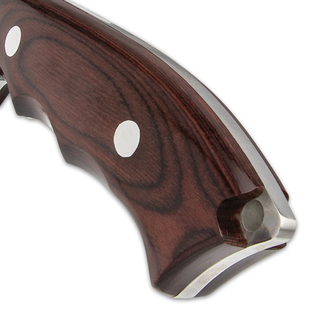 The finger-grooved, brown pakkawood handle scales are attached to the full-tang with large stainless steel pins image number 2