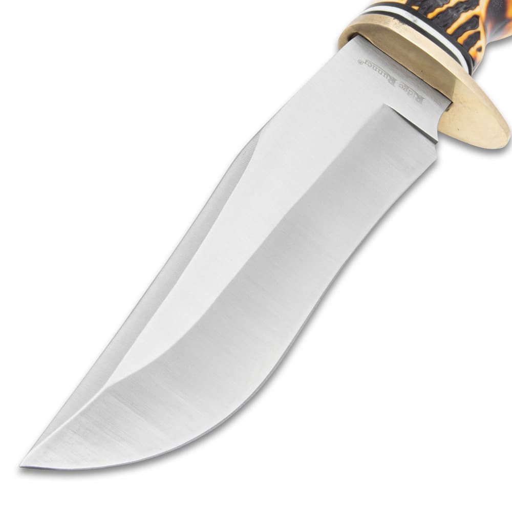 The drop point blade is made of stainless steel. image number 2