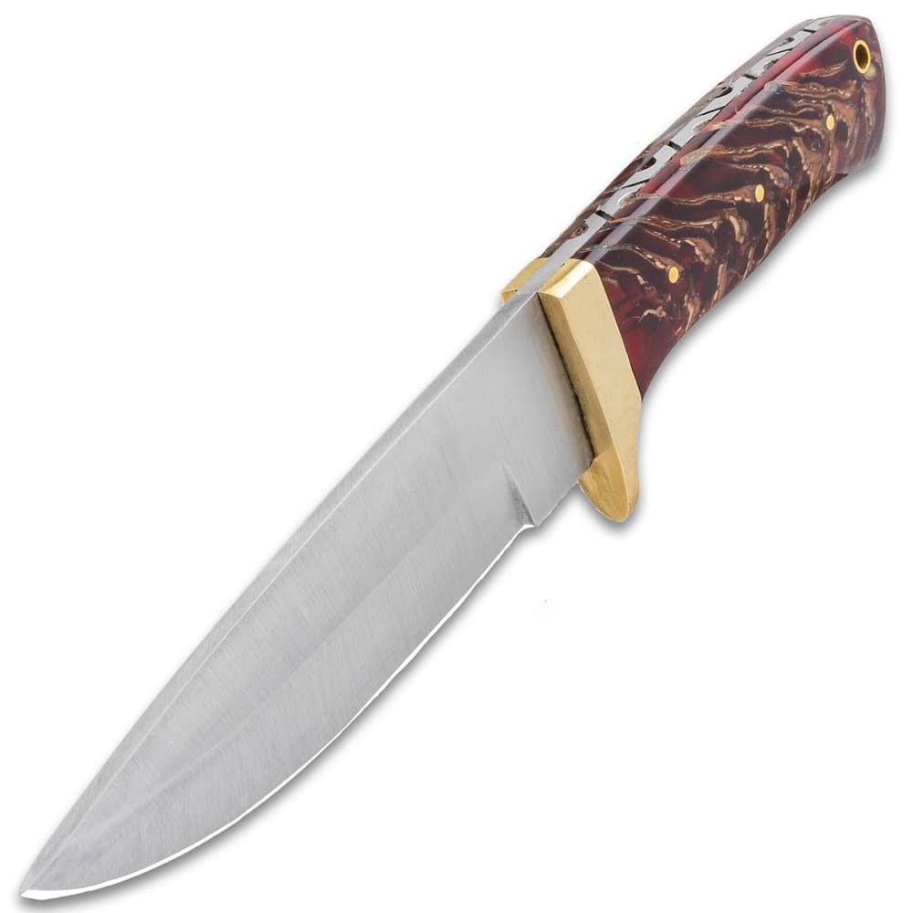 It has a fileworked, full-tang, 4 3/4” stainless steel, drop point blade, which extends from a polished brass half-guard image number 2
