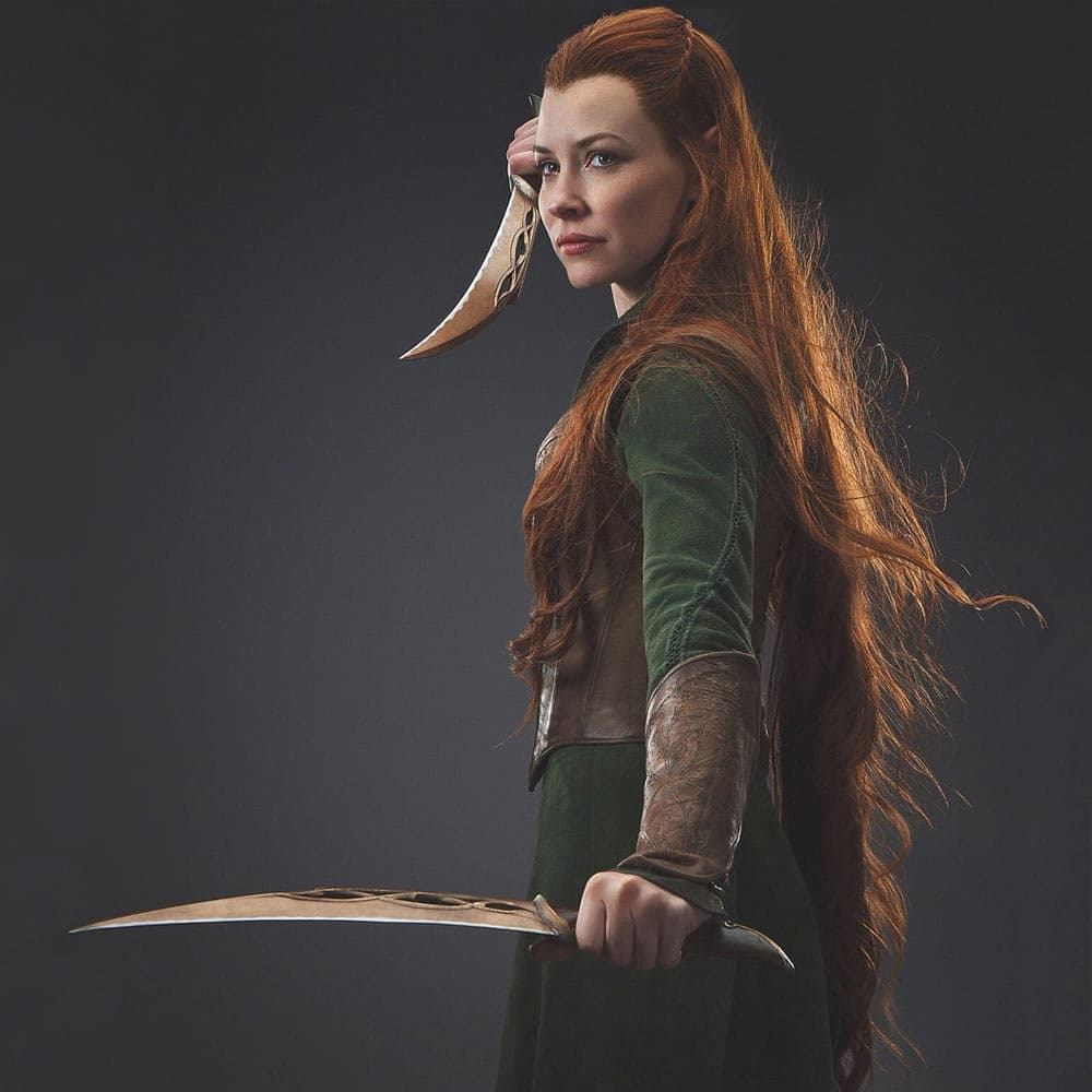 The Hobbit character Tauriel is shown holding bronzed dual daggers. image number 2
