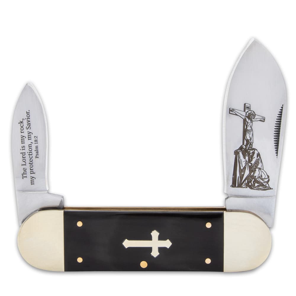 The pocket knife has stainless steel blades with laser-etched artwork with a Bible verse and nail nicks for opening image number 2