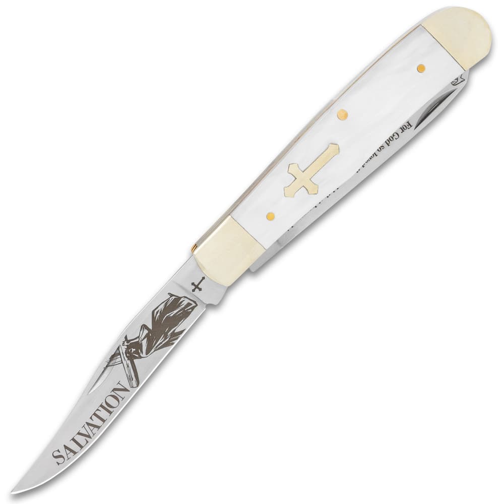 The trapper has a clip point blade with laser-etched artwork image number 2