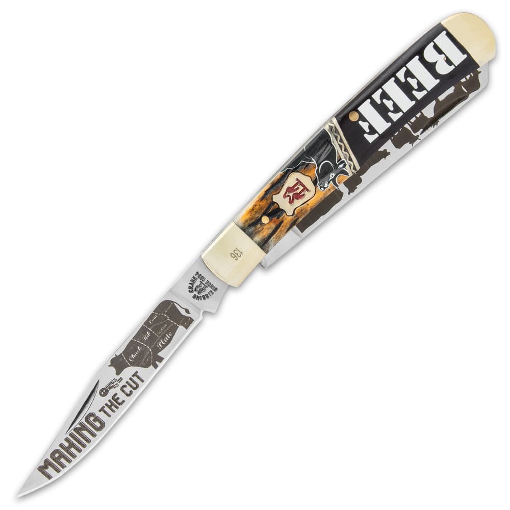 The trapper has two stainless steel blades, which have “Making the Cut” and beef-themed etchings and our limited edition stamp image number 2