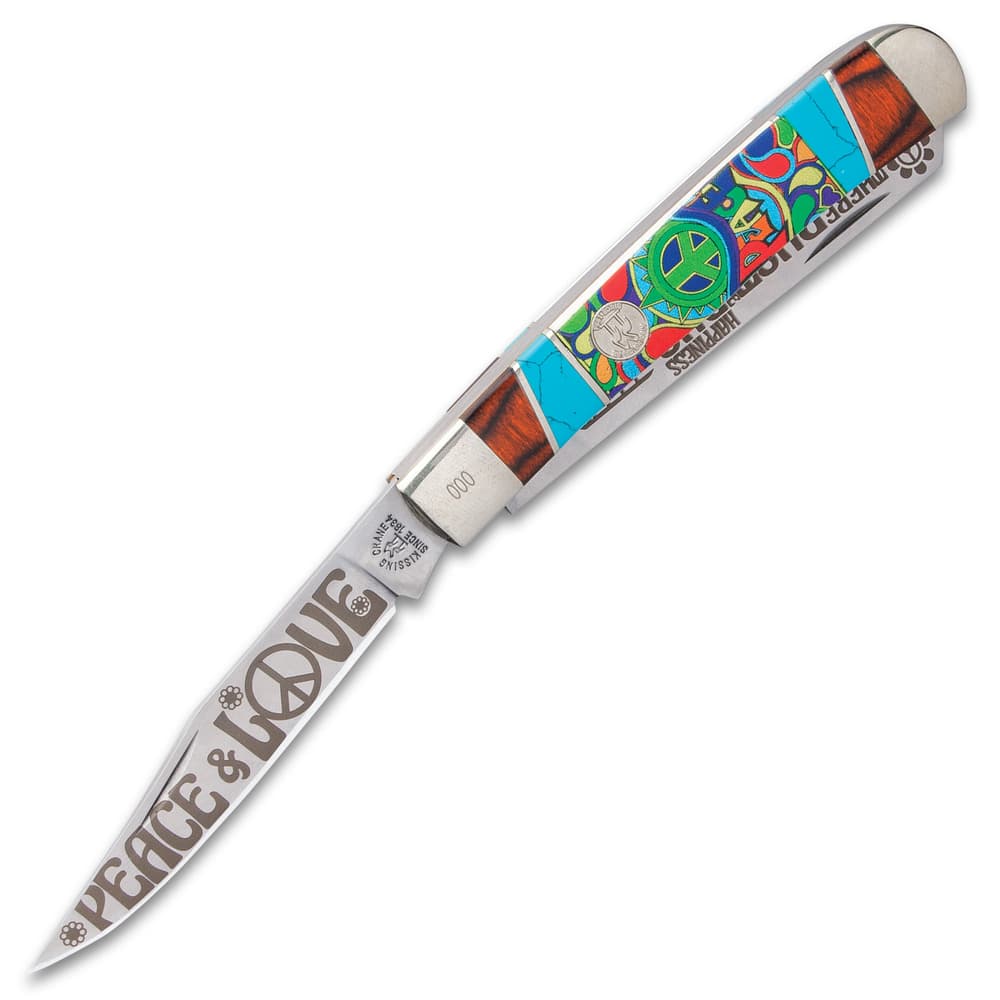 The pocket knife has razor-sharp 440 stainless steel blades with “Peace and Love” themed etchings including a VW bus image number 2