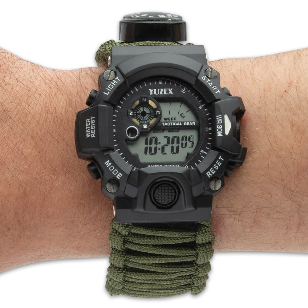 The water-resistant watch has a stainless steel and hard TPU case with an OD paracord-wrapped adjustable Velcro band image number 2