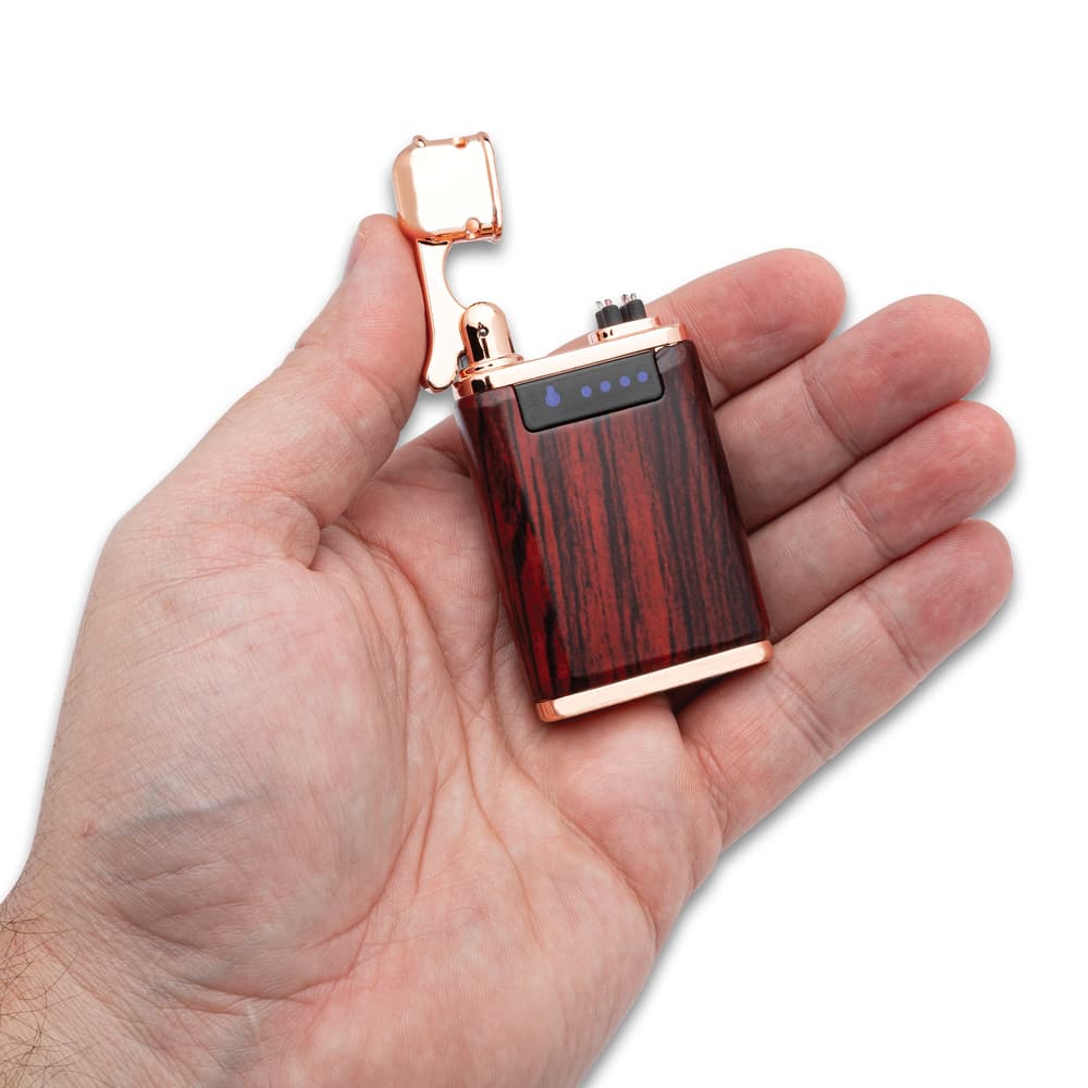 Close up image of USB Rechargeable Lighter held in hand. image number 2