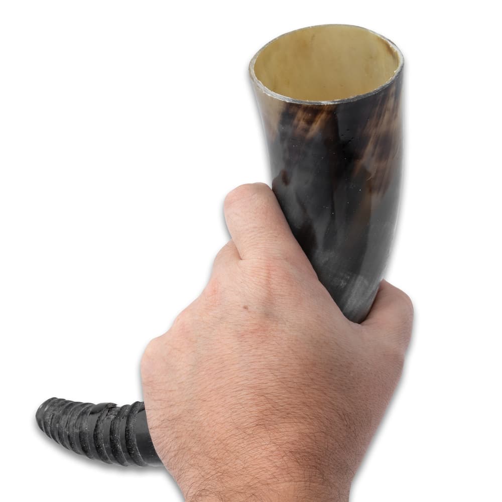 The buffalo horn can be used to drink your favorite beverage in image number 2