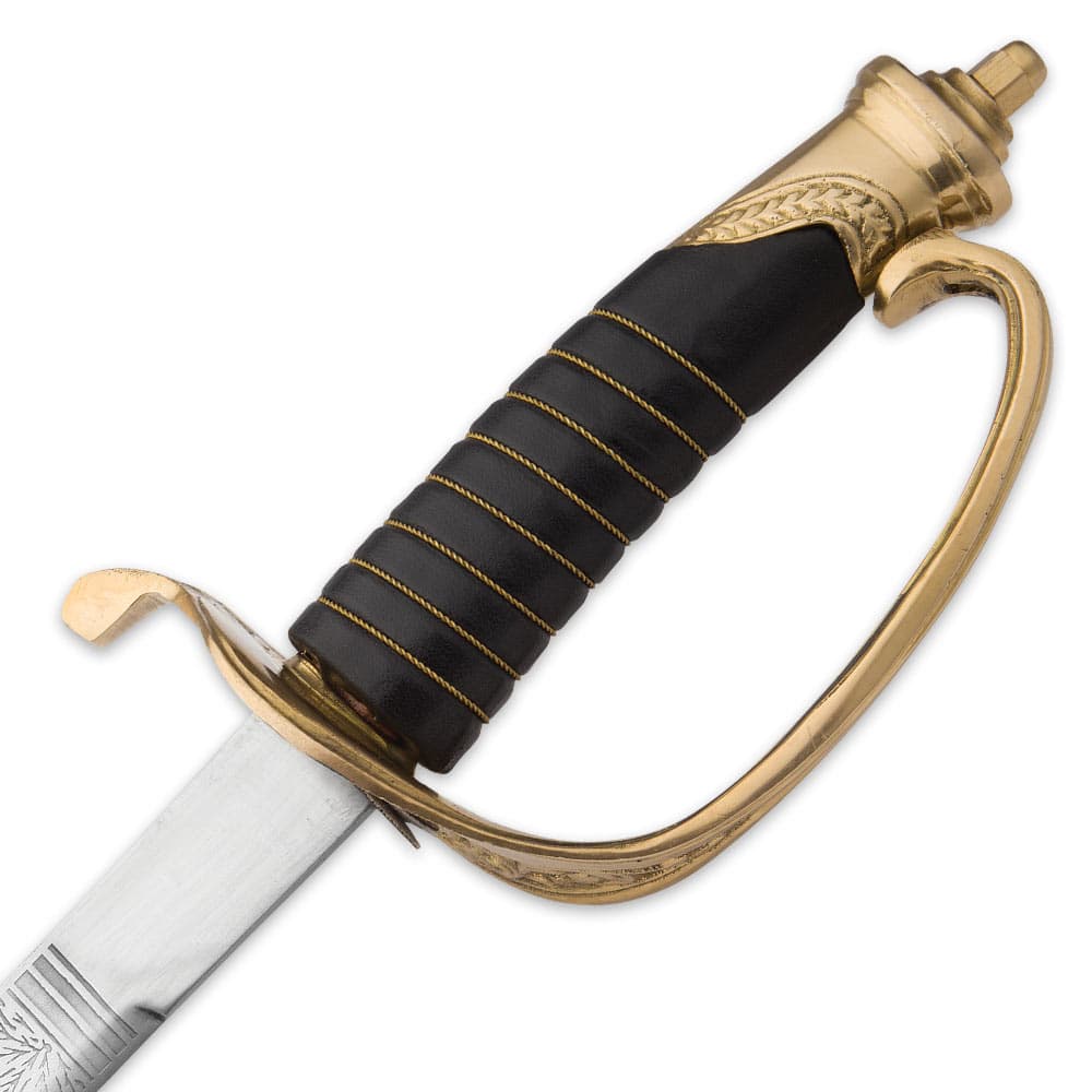 Close-up of the solid brass handguard and genuine leather wrapped handle with brass colored stitching. image number 2