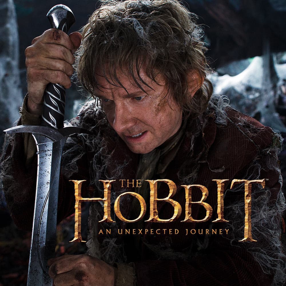 Bilbo Baggins is shown holding the Sting sword in a shot from the film. image number 2
