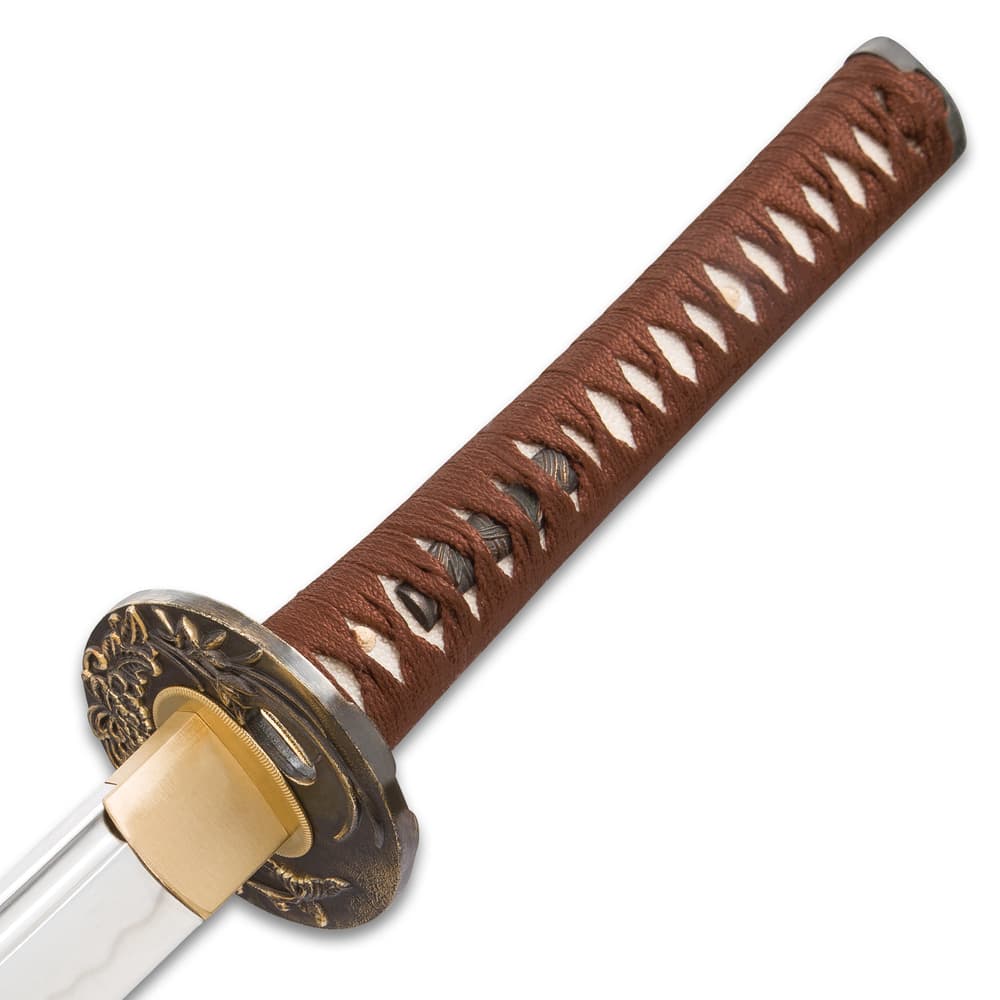Detailed view of the white genuine ray skin handle wrapped in brown cord with menuki. image number 2