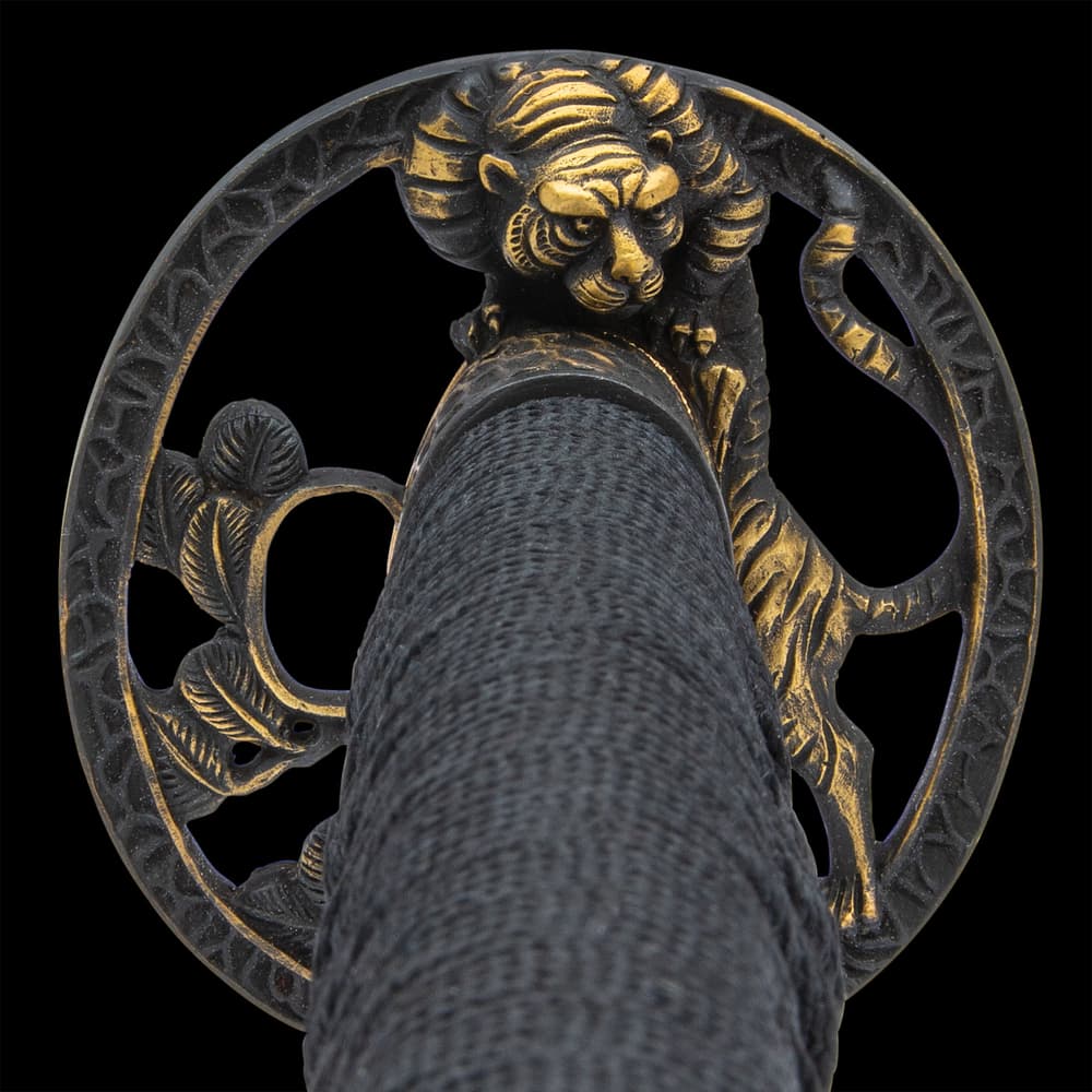 It has an antiqued brass, round tsuba with an intricately detailed tiger in an open design image number 2
