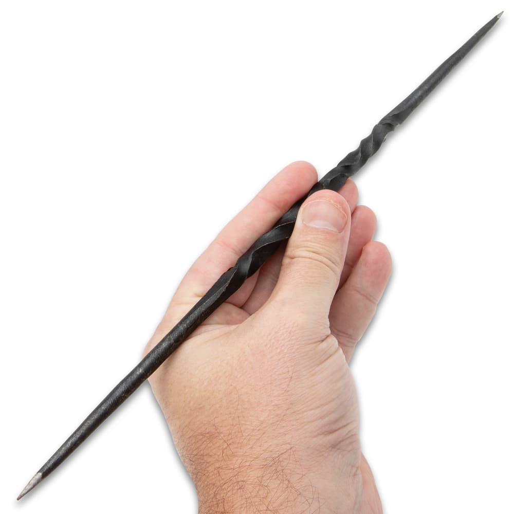 A hand is shown gripping a target spike by its twisted middle section. image number 2