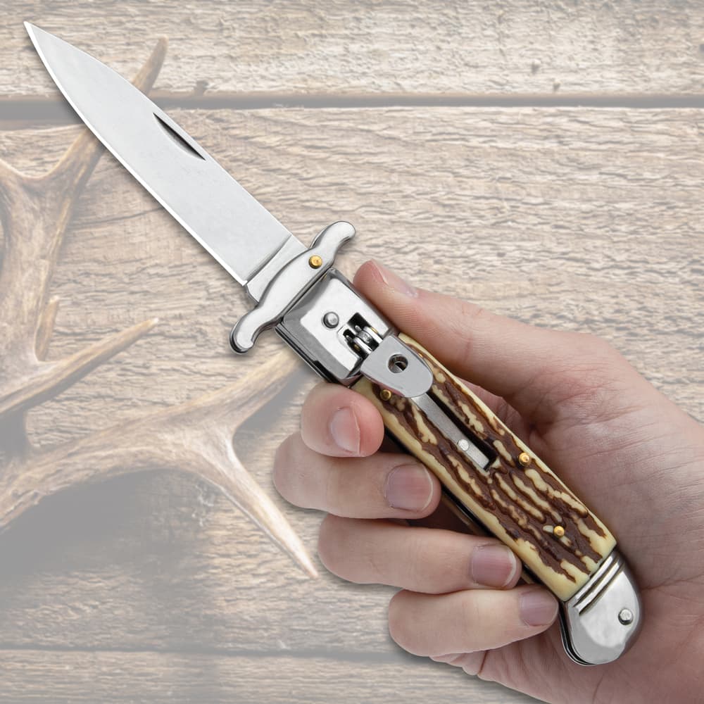 The Staghorn Automatic Stiletto Knife shown in hand for size reference image number 3