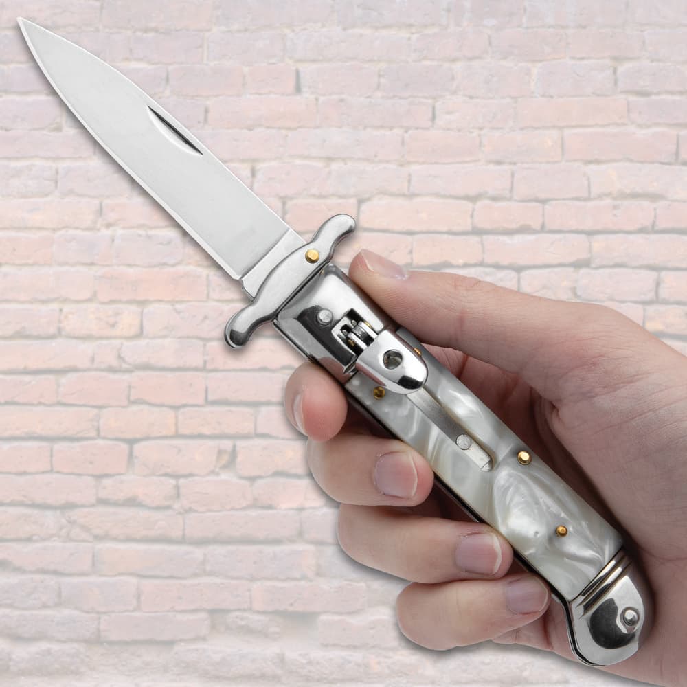 The Marble Automatic Stiletto Knife held displayed in hand image number 3