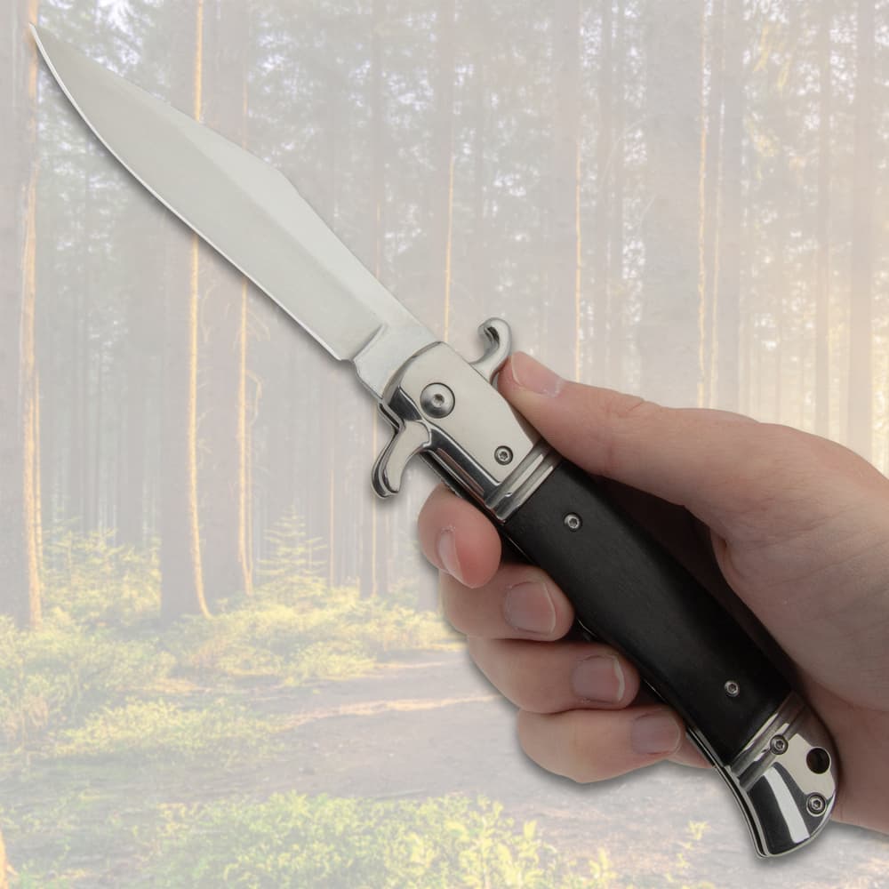The Darkwood Automatic Knife shown in hand for size reference image number 3