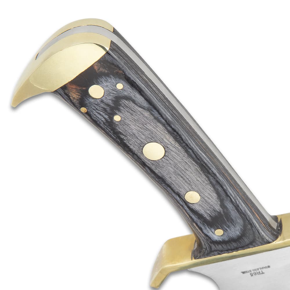 Side view of the gray hardwood handle with brass-plated guard and angled brass-plated pommel. image number 3