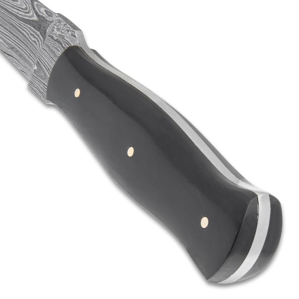 The handle scales are crafted of genuine black horn and are secured to the tang with brass pins image number 3
