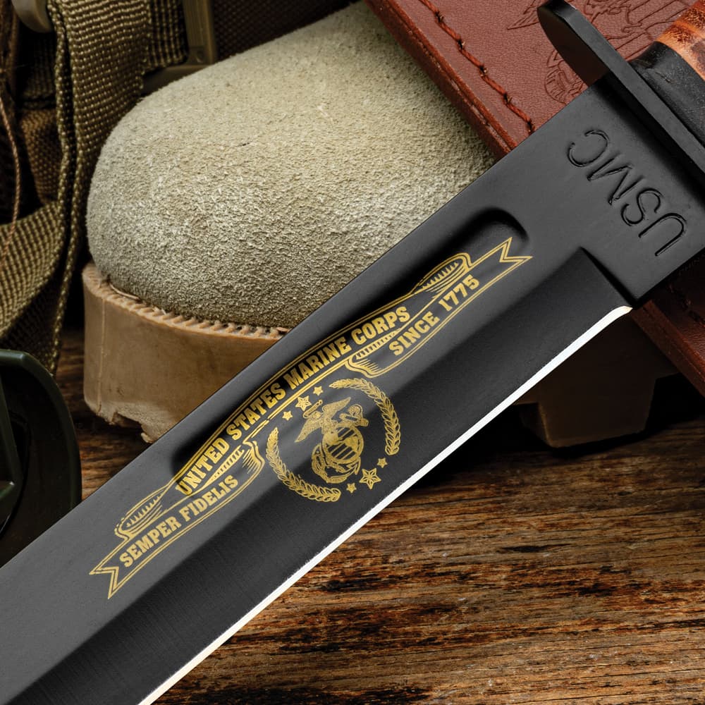Close up image of the Tribute Combat Knife USMC themed artwork on the blade. image number 3