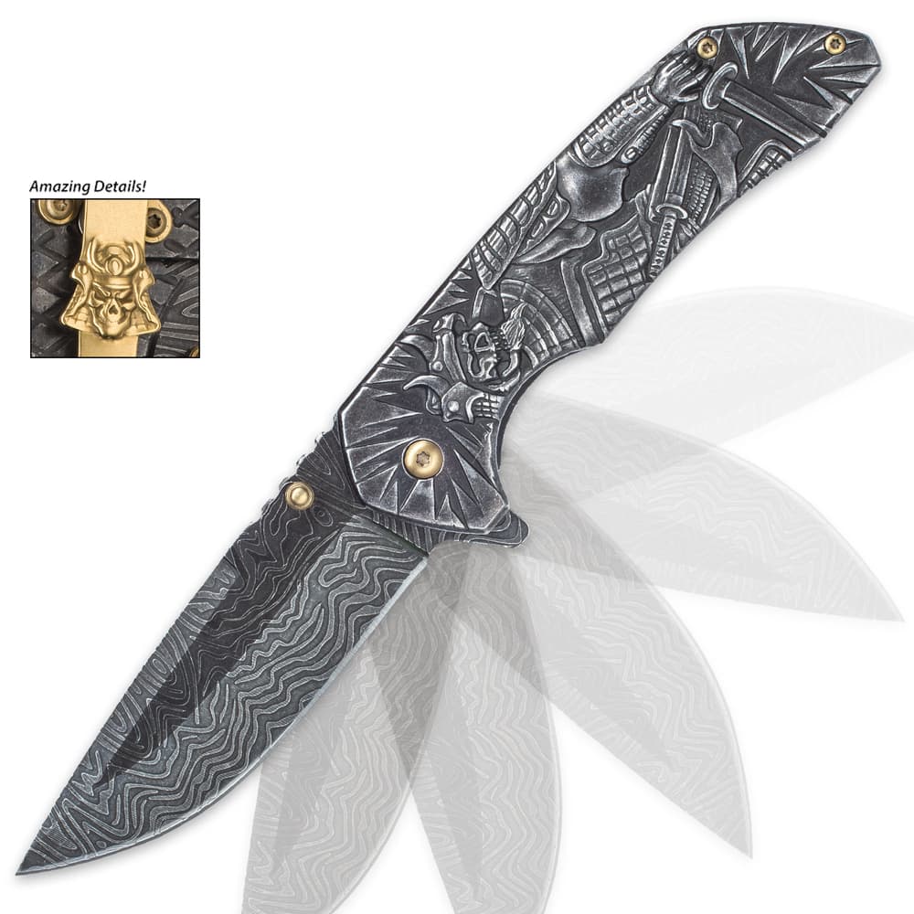 The knife is shown in action with its assisted opening mechanism, flipper and gold pocket clip with skull medallion. image number 3