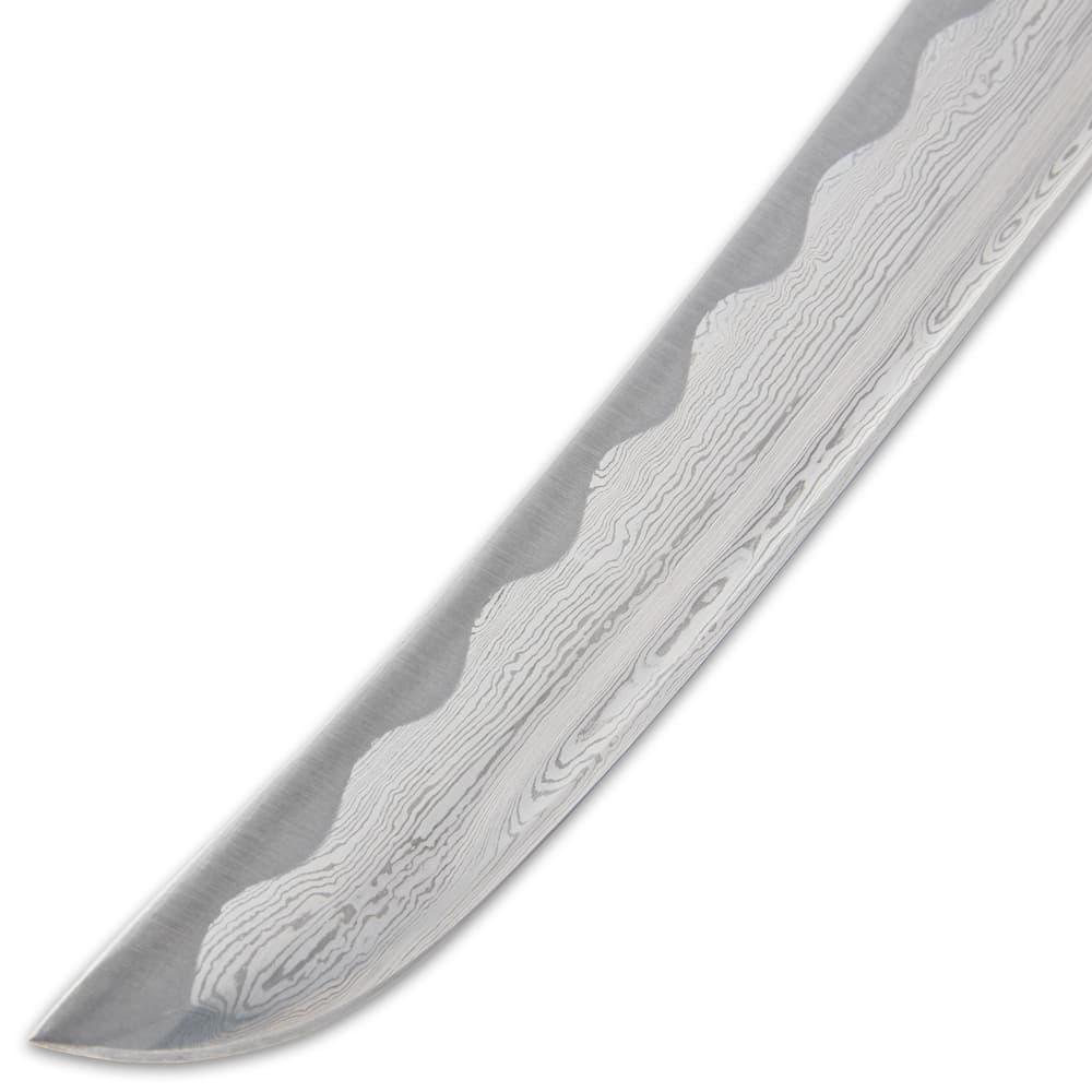 It has a hair-splitting sharp, 9 1/4” Damascus steel tanto blade, which extends from a brass habaki image number 3
