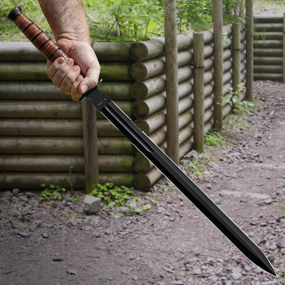 The sword has a genuine, stacked leather handle, complemented by a black, stainless steel guard and end-cap image number 3