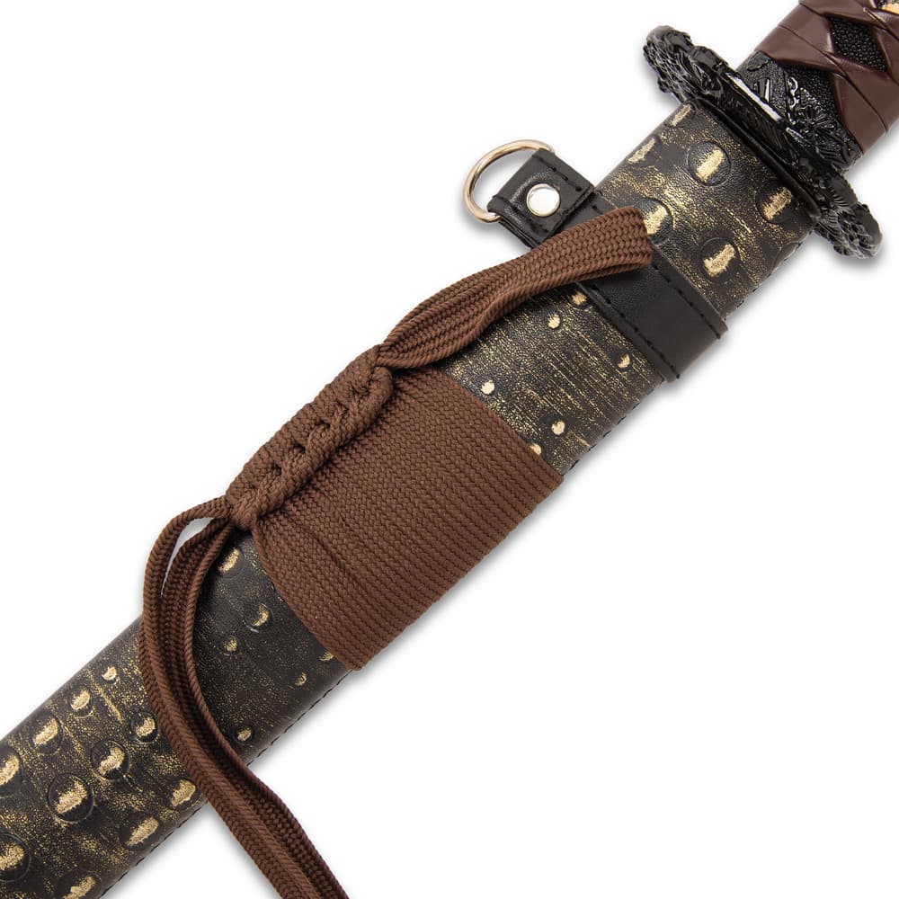 The 39” katana slides into a distressed leather-wrapped wooden scabbard, which has an adjustable leather shoulder strap image number 3
