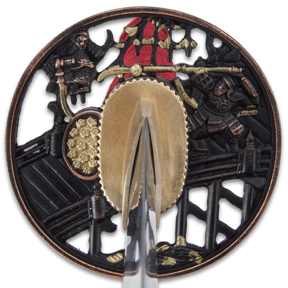 The hardwood handle is traditionally wrapped in faux rayskin and red cord and has an intricately detailed metal tsuba image number 3