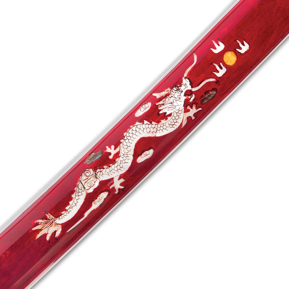 Detailed view of the mother-of-pearl dragon on the side of the red scabbard. image number 3