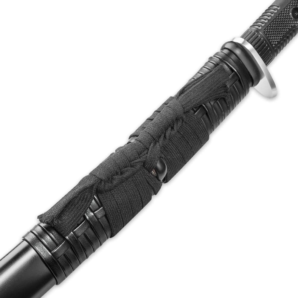 Close up view of sageo wrapped with a black cord around a black knob image number 3