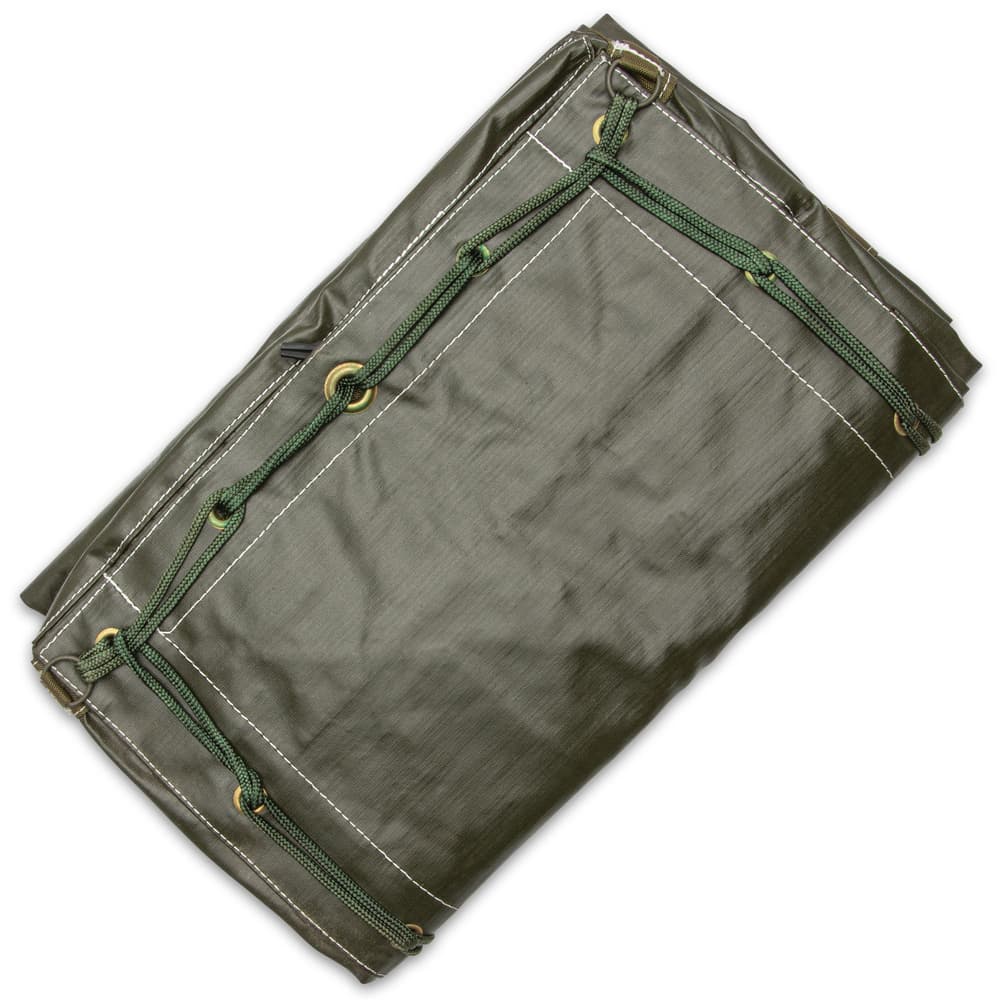 The like new duffle bag is made of water-resistant, olive drab vinyl material and has a single sturdy shoulder strap image number 3