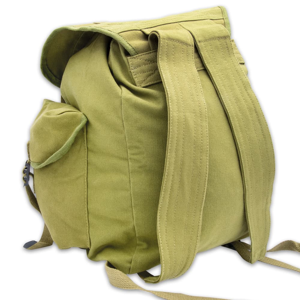 It has a large, main compartment with a drawstring top and a flap that’s secured with nylon webbing straps and metal buckles image number 3