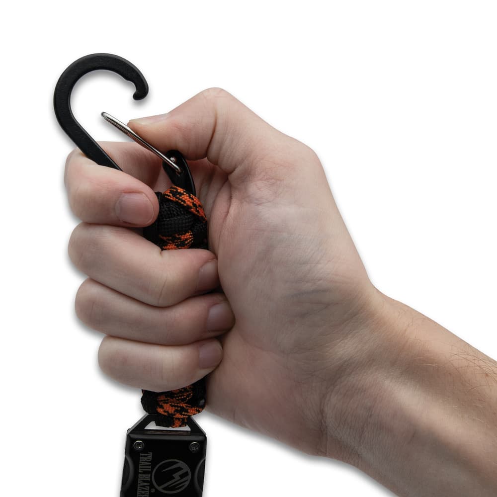 Opening the carabiner clip on the lanyard image number 4