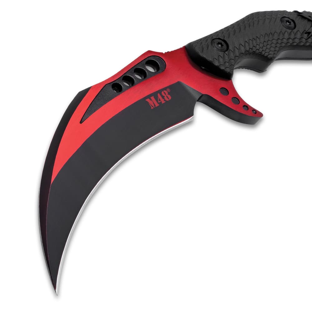 The karambit's 4 5/8" blade is made of stainless steel image number 4