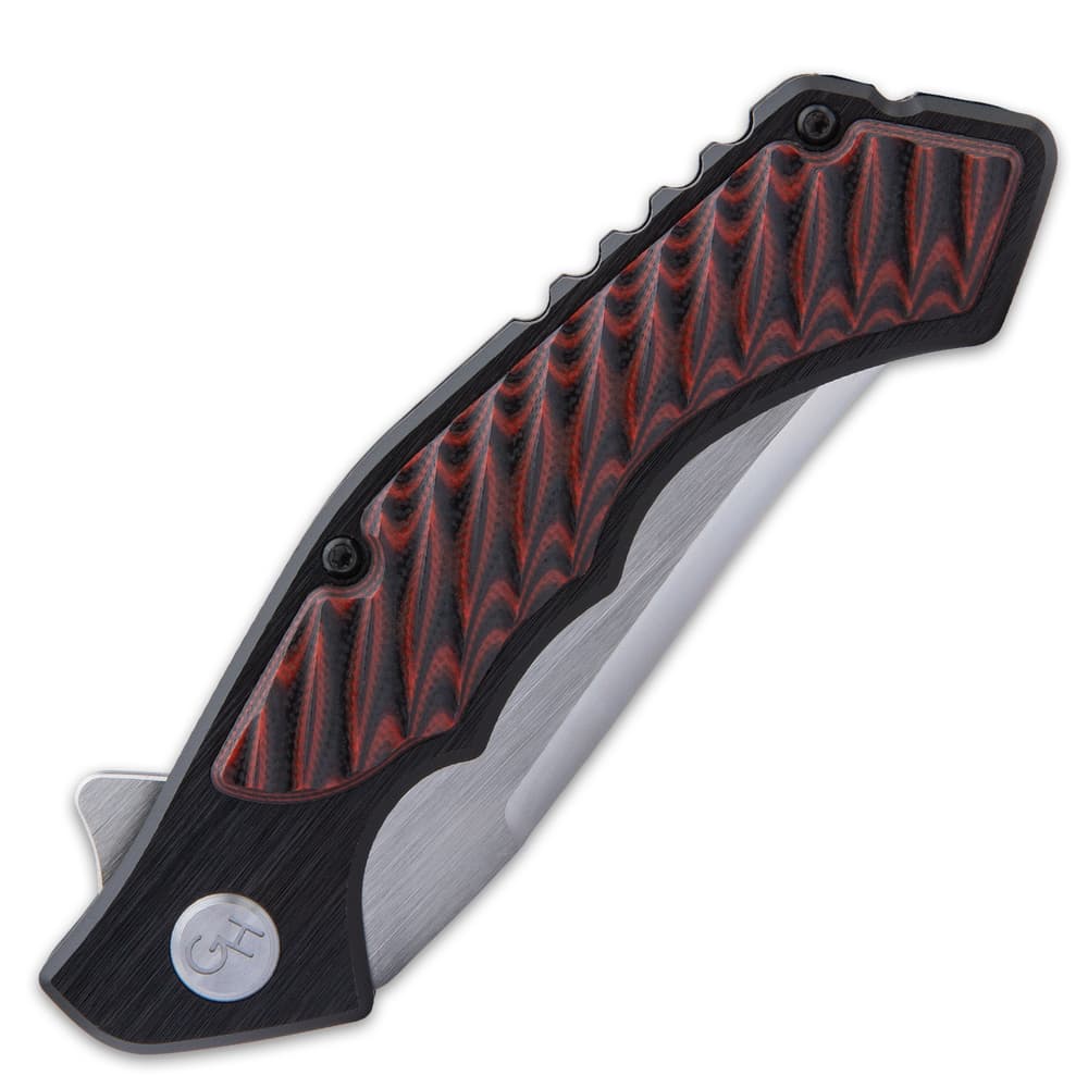 The handle is black, anodized 6061 aluminum with red and black, layered G10 inserts and a lanyard hole image number 4