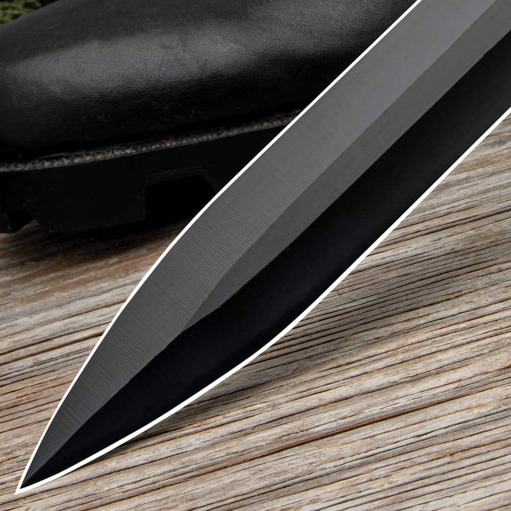 The sword has a genuine, stacked leather handle, complemented by a black, stainless steel guard and end-cap image number 4