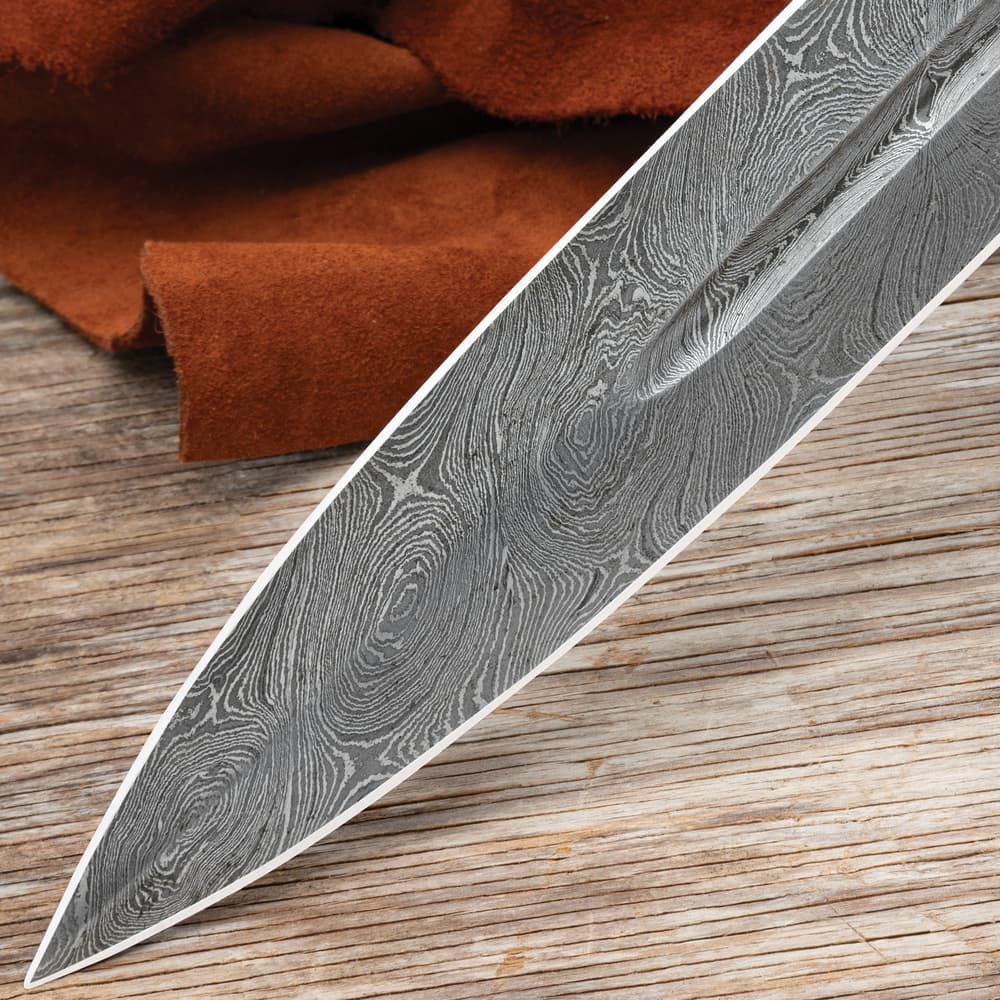 A detailed look at the Damascus steel sword's blade point image number 4