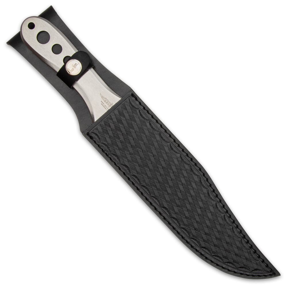 Polished throwing knife in black leather sheath with cross hatched pattern and button closure. image number 4