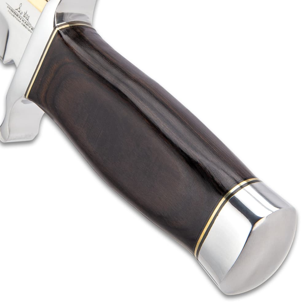 The knife’s handle is made of hardwood and has a polished stainless pommel. image number 5
