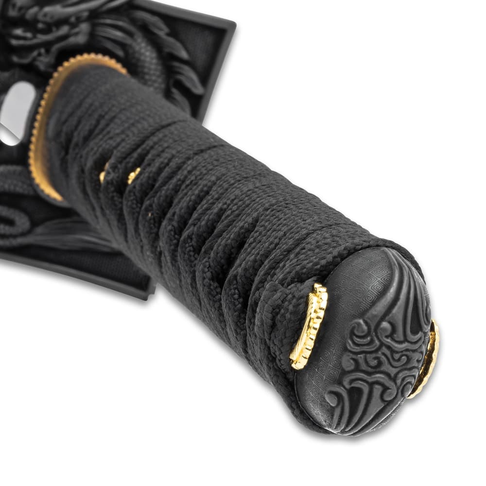 Zoomed view of black nylon wrapped hilt and etched pommel with accents of gold image number 5