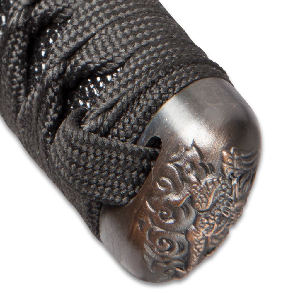 The black cord of the handle wraps through the antique finished pommel. image number 5