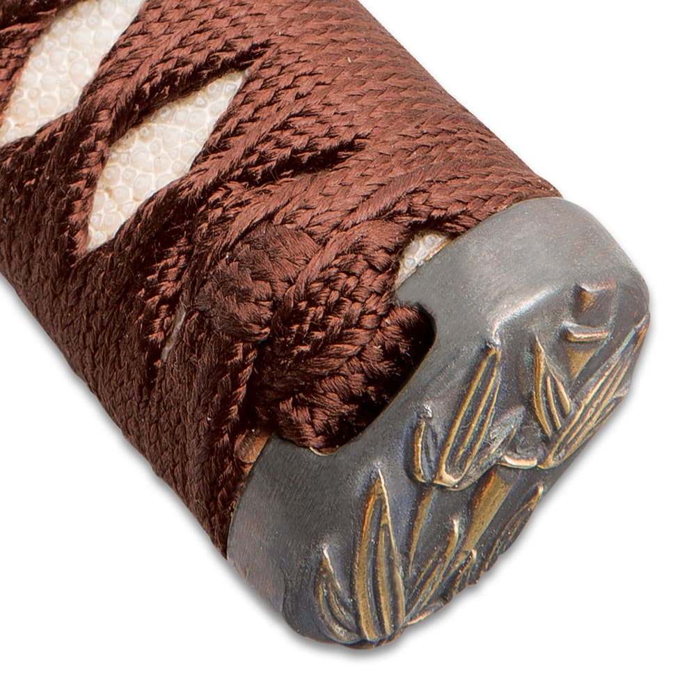 The pommel has a bamboo leaf design just above the brown cord wrapped handle. image number 5