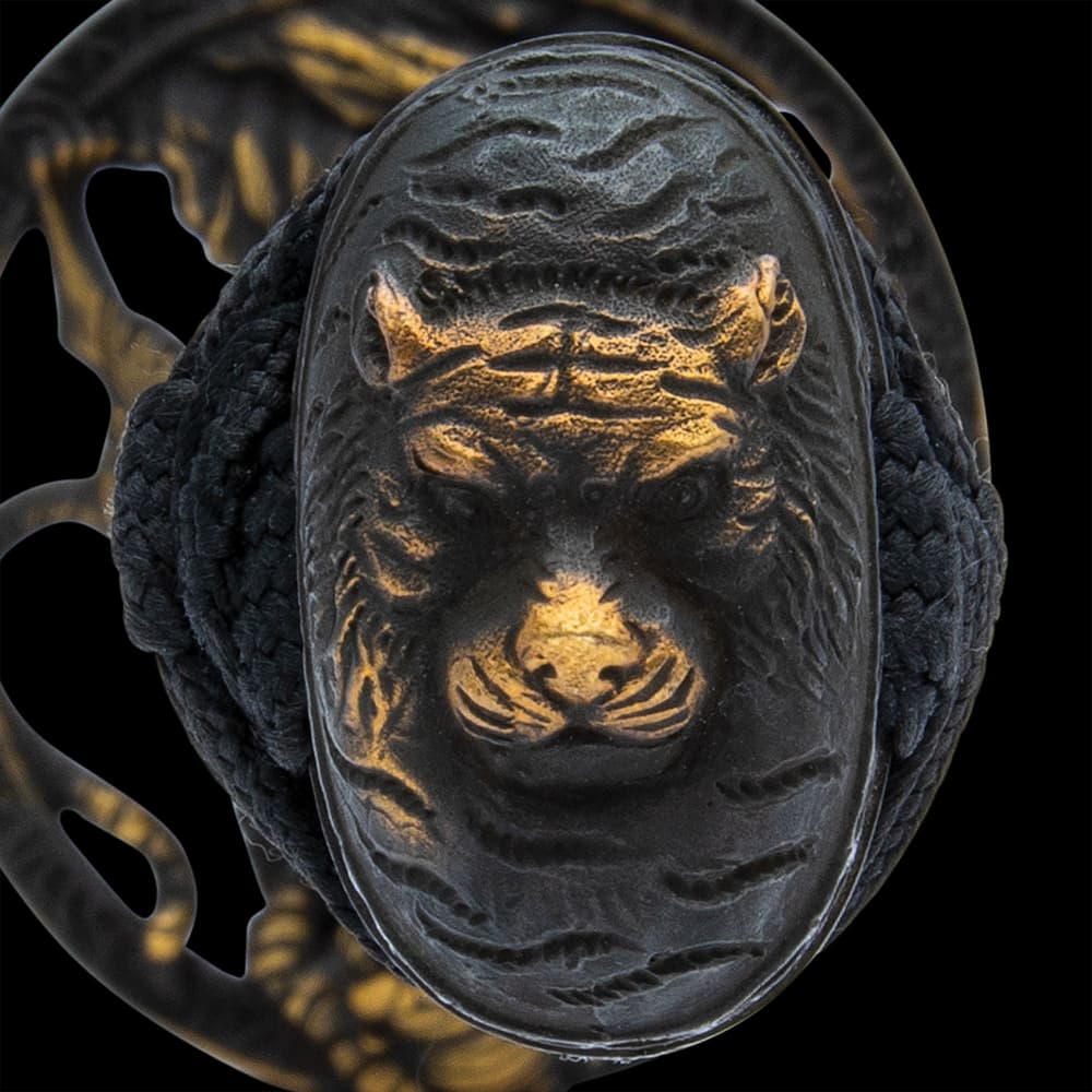 It has an antiqued brass, round tsuba with an intricately detailed tiger in an open design and a pommel to match image number 5