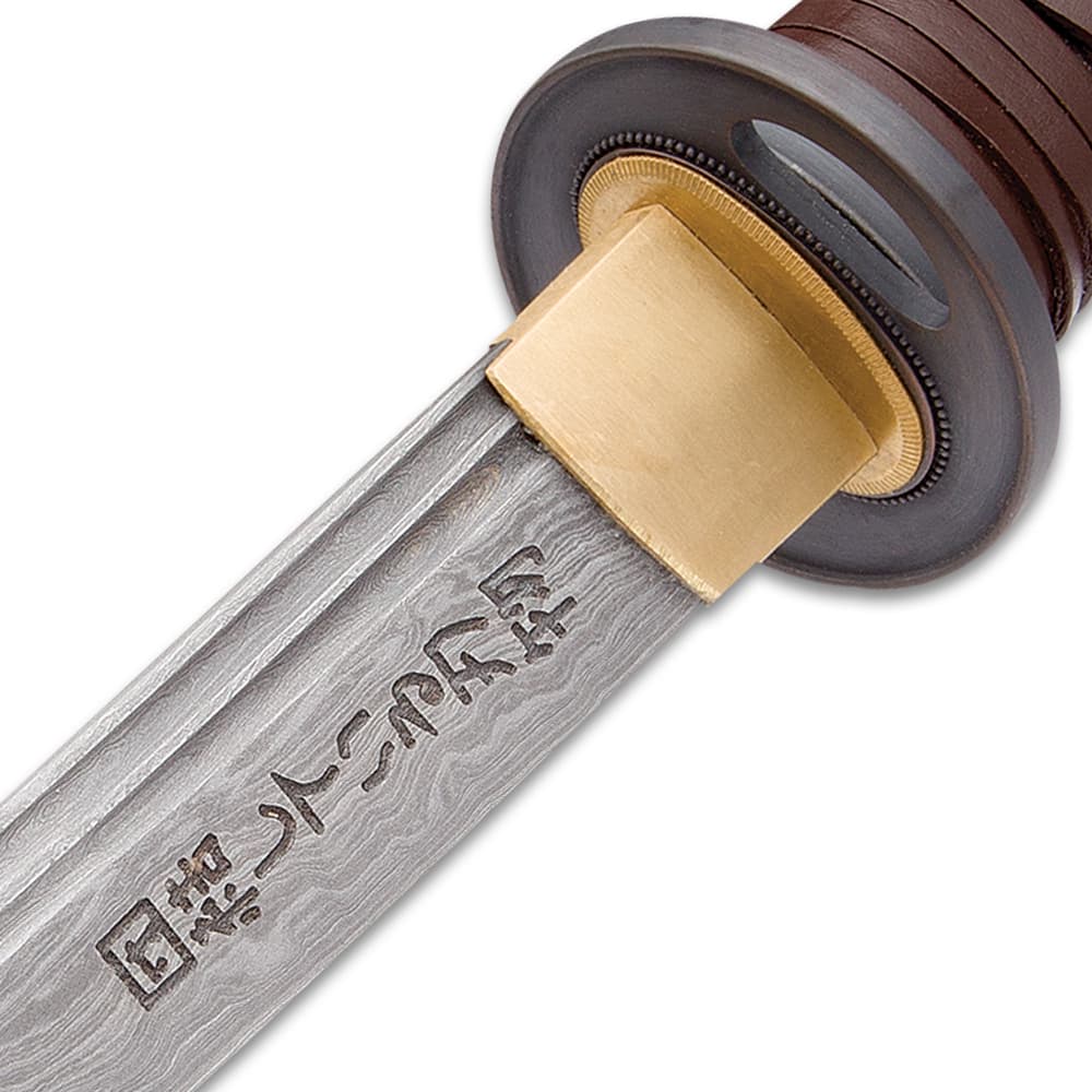 Kanji is engraved into the Damascus steel blade, just below the brass habaki. image number 5