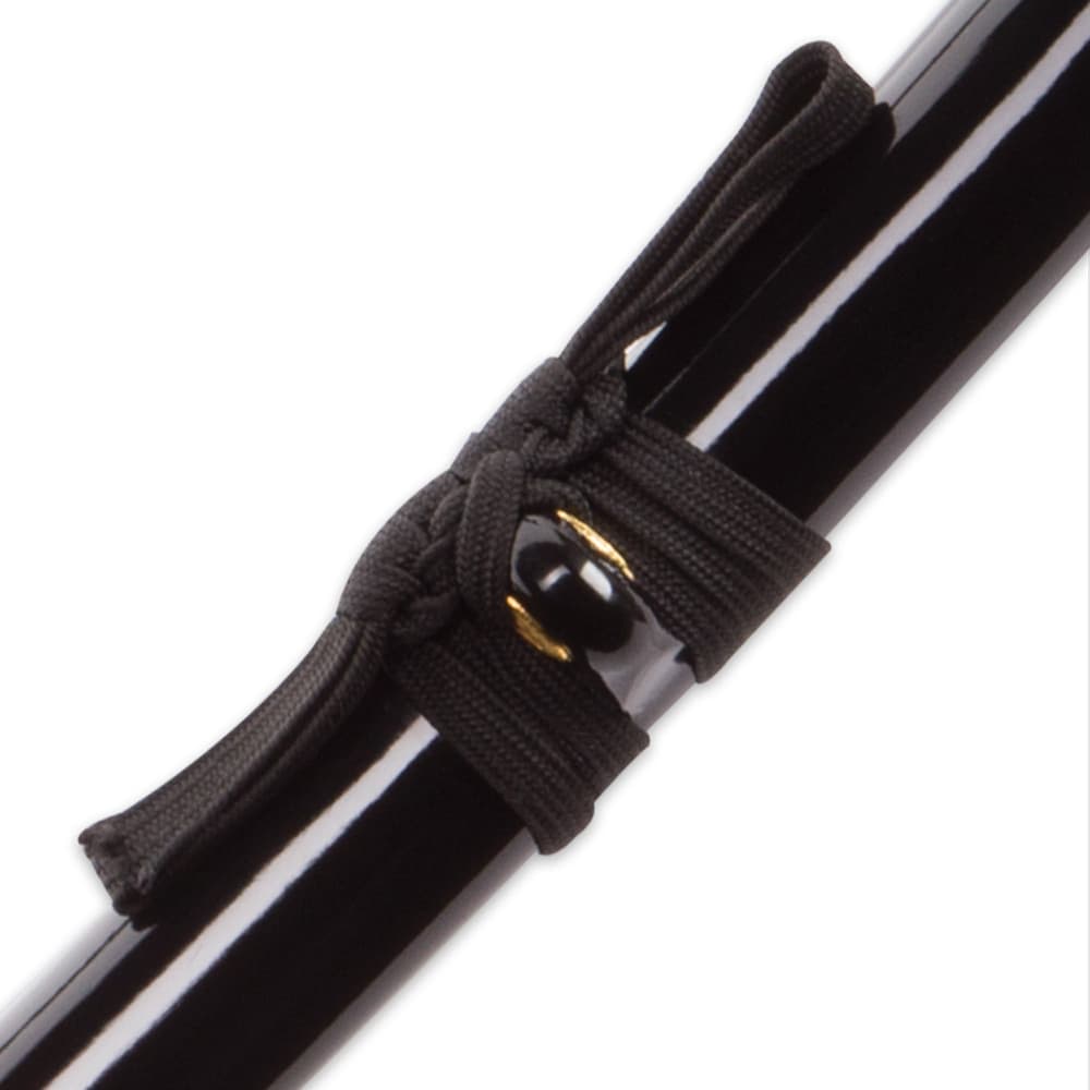 "Zoomed display of solid black lacquer finished hardwood scabbard with black nylon cord wrapped around brass knob" image number 6