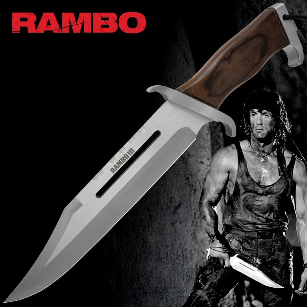 Rambo 3 Fixed Blade Knife Replica Rugged Knife with double-edged stainless steel blade the handle is dark wood with visible grain curved for grip. image number 0