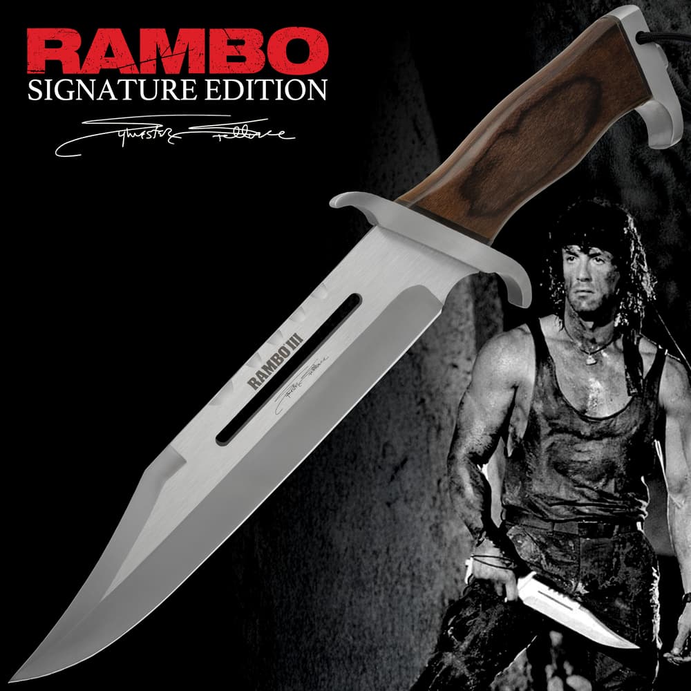 Rambo 3 Signature Edition Knife Stallone.A clip point with a sharp tapered tip blade engraved with "Rambo III" and a signature handle made of dark wood with visible grain patterns. image number 0