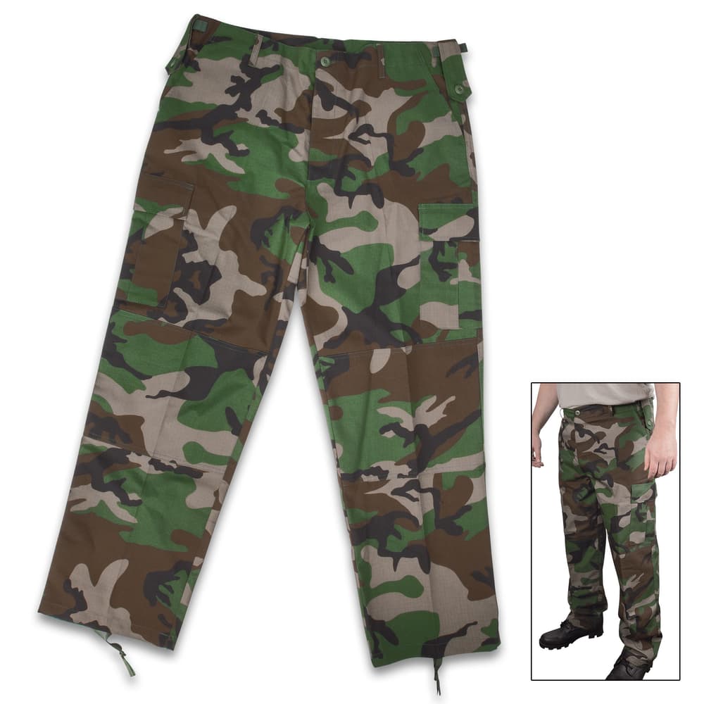 Our M48 Woodland Camo BDU Pants are built for the harshest conditions, making it a must-have to your hunting, tactical or survival gear image number 0